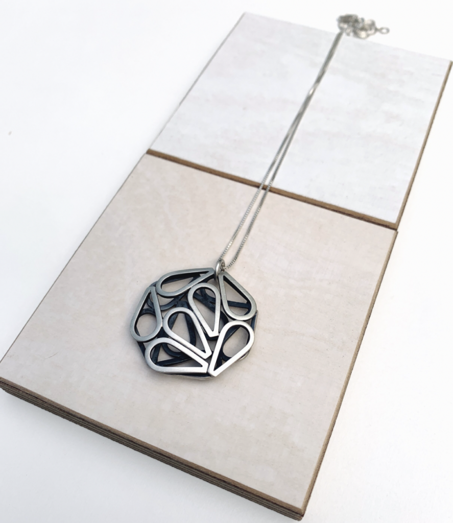 Emily Shaffer. Drop Disc Pendant, 2022. Sterling silver.